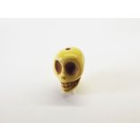 Koponya gyöngy (szinteteikus turquoise) - sárga